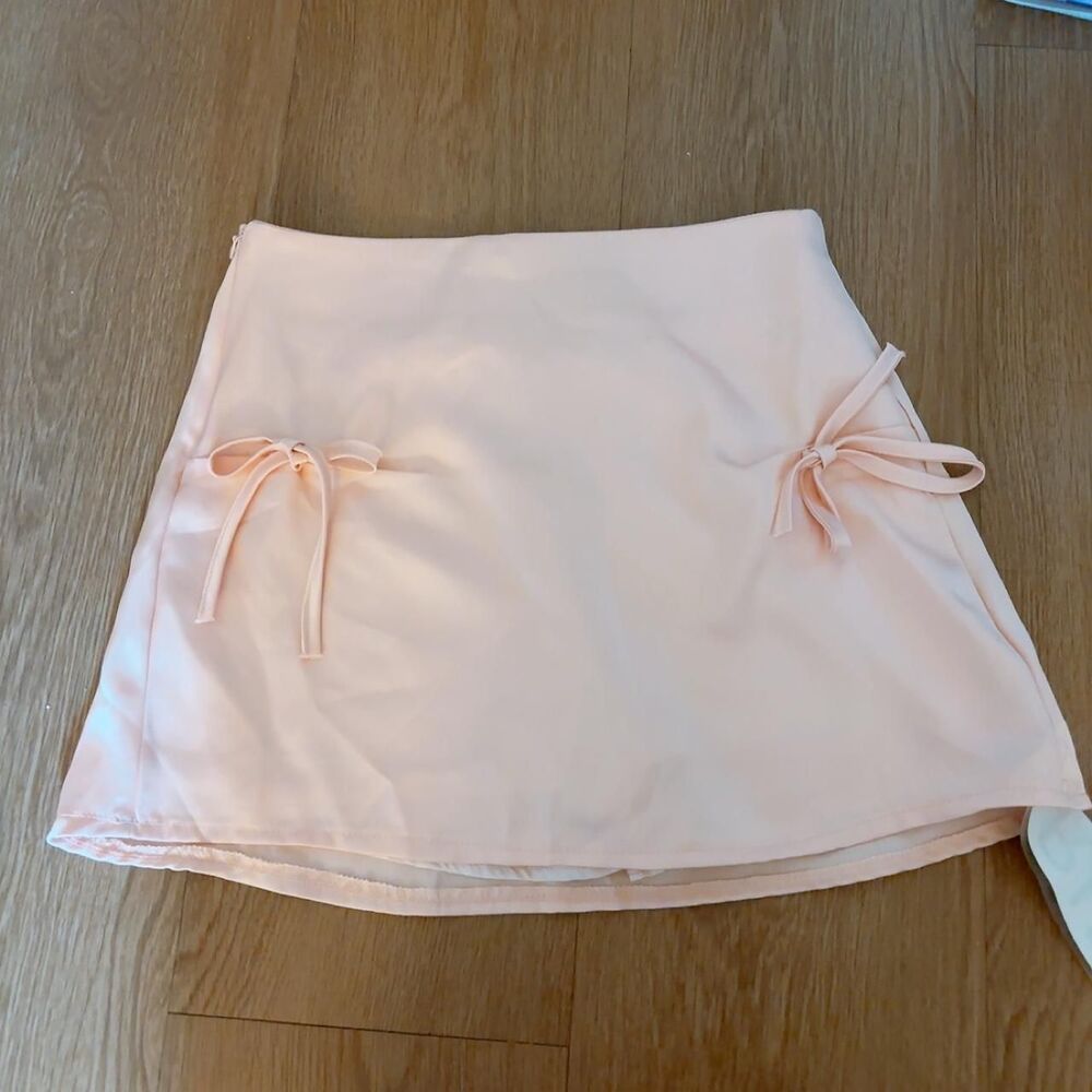 chinese brand Rune Is pink mini skirt with bow detail
